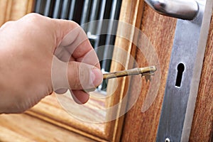 Unlocking a door with a house key