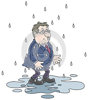 Unlucky wet man in a puddle in rain photo