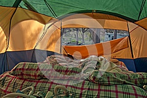 Unmade Airbed Inside Camping Tent photo