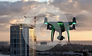 Unmanned Aircraft System Quadcopter Drone In The Air Near City and Corporate Building photo