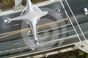 Unmanned Aircraft System Quadcopter Drone In The Air Over Roadway