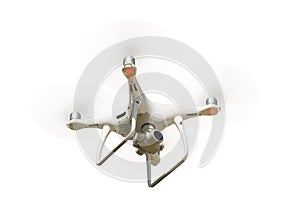 Unmanned Aircraft System (UAV) Quadcopter Drone In The Air Isolated on a White Background photo