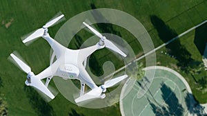 Unmanned Aircraft System UAV Quadcopter Drone In The Air Over