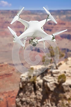 Unmanned Aircraft System UAV Quadcopter Drone In The Air Over