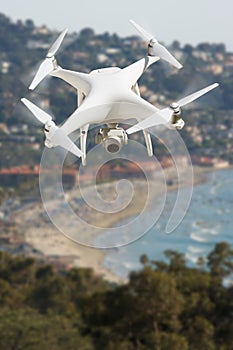 Unmanned Aircraft System UAV Quadcopter Drone In The Air Over