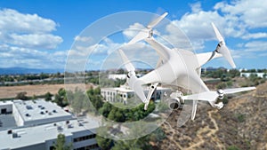 Unmanned Aircraft System UAV Quadcopter Drone Over Buildings