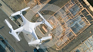 Unmanned Aircraft System UAV Quadcopter Drone Over Construction Site