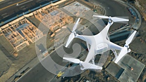 Unmanned Aircraft System UAV Quadcopter Drone Over Construction Site