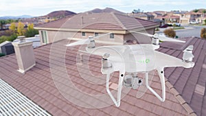 Unmanned Aircraft System UAV Quadcopter Drone Over Homes photo