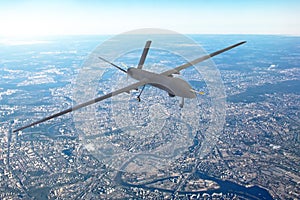 Unmanned military drone patrols the territory, flying over the disrtict of city.