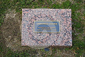 `Unmarked Graves` information stone and plaque inside the Freedman`s Cemetery Memorial in Dallas, Texas