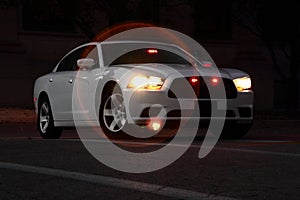 Unmarked Police Car At Night photo