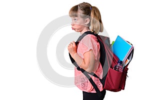 Unmotivated little girl with backpack with school supplies isolated