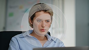 Unmotivated office worker looking laptop sitting workplace closeup. Lady reading