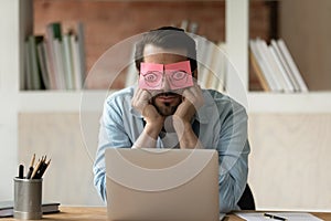 Unmotivated tired male employee sleep in office