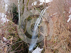 An unnamed waterfall in the canyon of the Fallenbach alpine stream above the Lake Walen or Lake Walenstadt Walensee, Amden