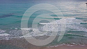 Unobstructed horizon on beach, ocean meets the sky in an uninterrupted line.