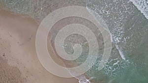 Unobstructed horizon on beach, ocean meets the sky in an uninterrupted line.