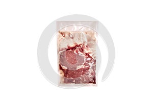 Unopened pack of 1 raw beef steaks isolated on white background.