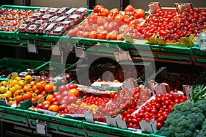 Unpacked, fresh assortment of tomatoes in a self-service supermarket