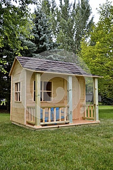 Unpainted backyard playhouse