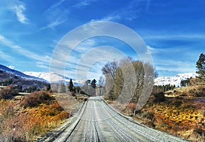 An unpaved road in Mackenzie District of Canterbury Region of the South Island of New Zealand in the winter