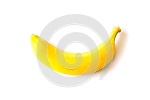 Unpeeled single banana isolated on white