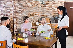 Unpleased client talking with manager in restaurant