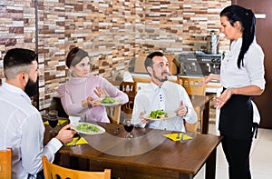Unpleased client talking with manager in restaurant