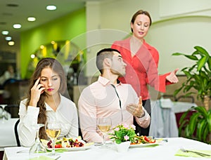 Unpleased couple in restaurant