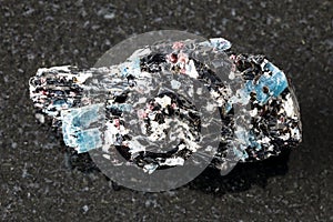 Unpolished Biotite with Kyanite crystals on black