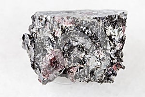 Unpolished red Garnet crystals in Biotite on white photo