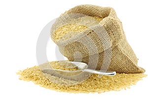 Unpolished rice (whole grain) in a burlap bag