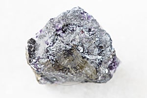 unpolished Stibnite (Antimonite) ore on white