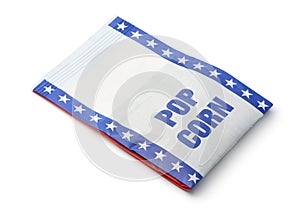 Unpopped microwave popcorn in paper bag