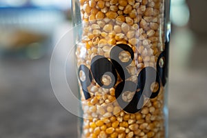 Unpopped Popcorn in vintage 1970s era glass jar.