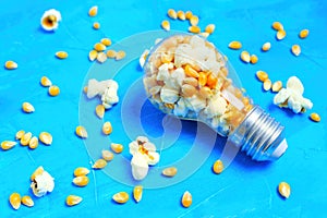 Unpopped and popped corn kernels in a lightbulb