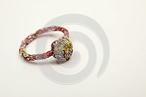 Unpretentious ring made from recycled materials on a white background
