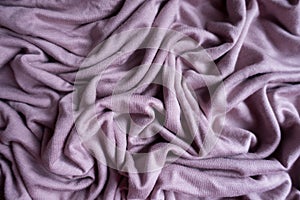 Unprinted pink fabric in soft folds from above