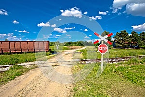 Unprotected railroad crossing country road view
