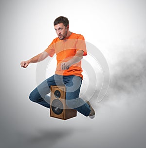 Unreal flying man on wooden speaker