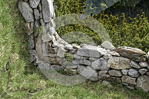 Unreal stone fence in a mountain landscape, two images with 90 degrees angle photo
