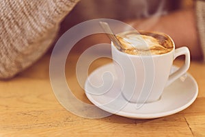 Unrecognisable man drinking coffee and having breakfast.