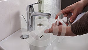 Unrecognisable person washing hands