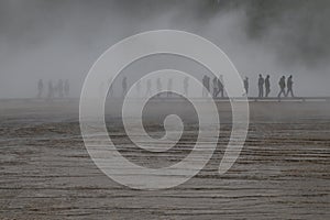 Unrecognised people walking around Grand Prismatic Spring