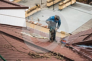 Unrecognised worker on modern roof, construction industry