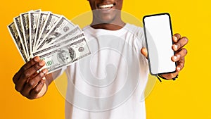 Unrecognizable african american man holding bunch of money