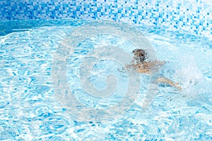 Unrecognizable Alone Little kid boy drowning in the pool