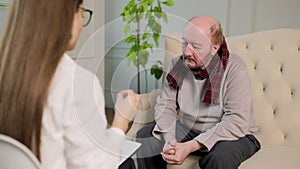Unrecognizable blurred background selective focus psychologist hand gesticulate talks to client