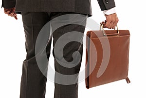 Unrecognizable businessman back suitcase isolated